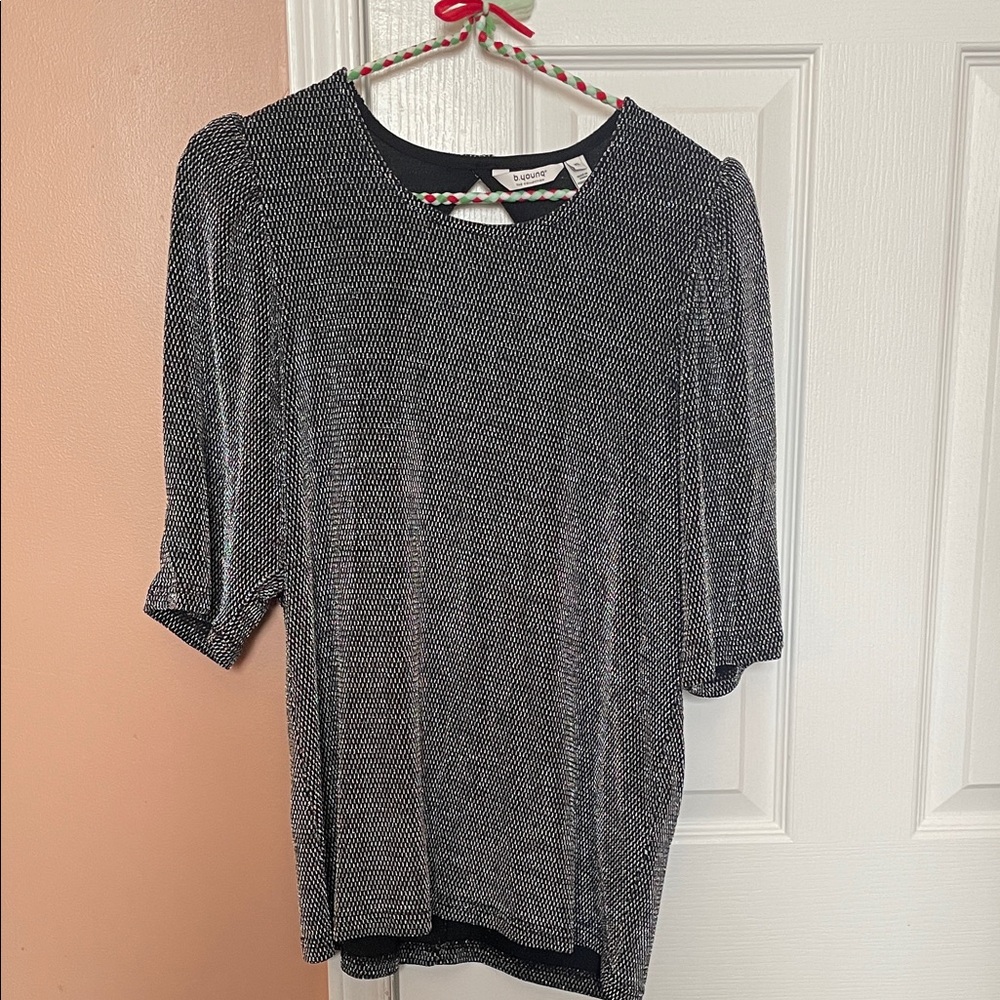 B. Young Black and Silver top